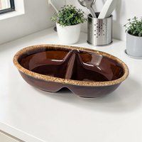 A shallow, round ceramic bowl with a rich dark chocolate brown glaze. A thick, frothy cream-colored drip effect rings the smooth top edge, flowing downward toward the center in an organic pattern.
