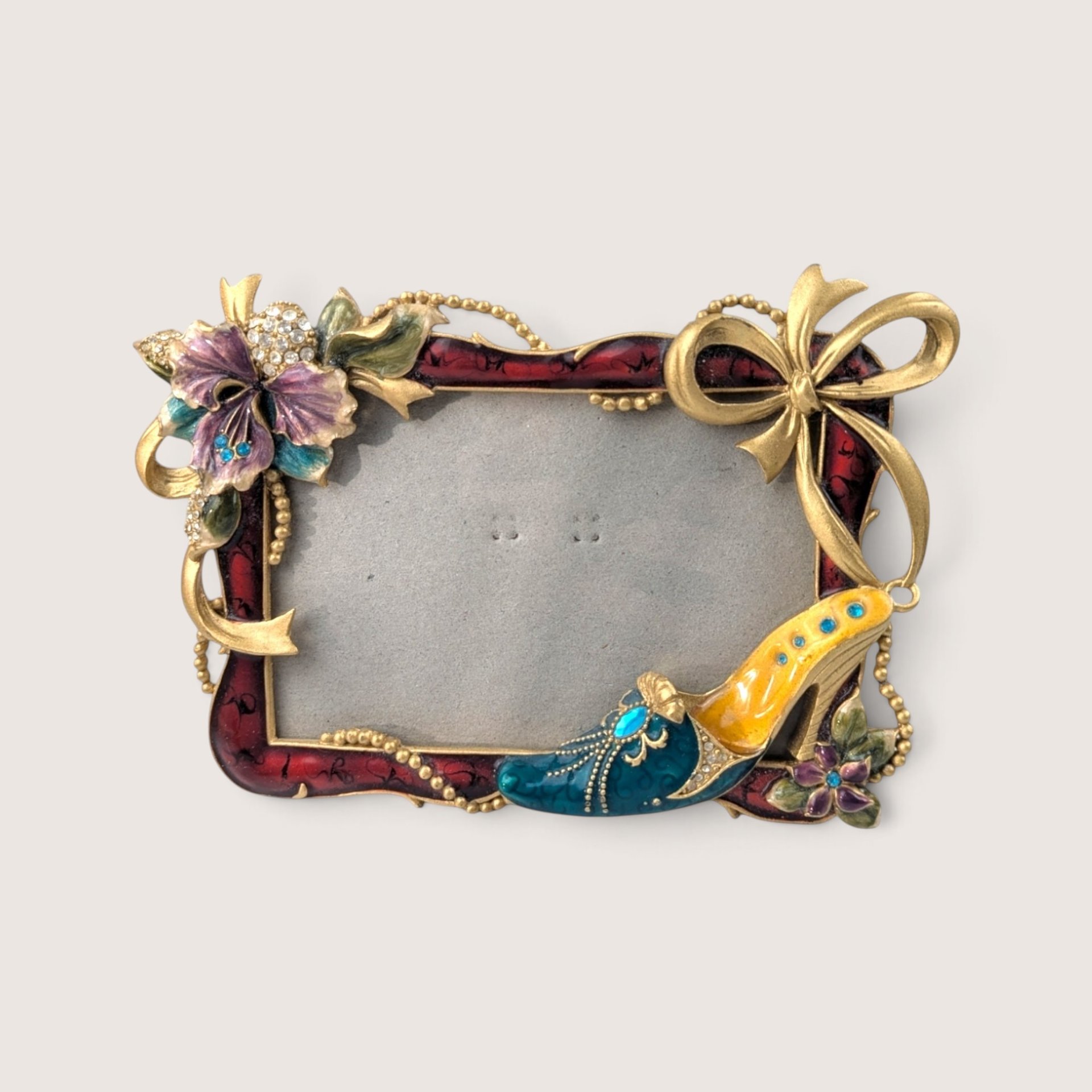 Vintage 2000s enameled metal photo frame with a 3D jeweled high heel shoe, purple flower, and gold bow.