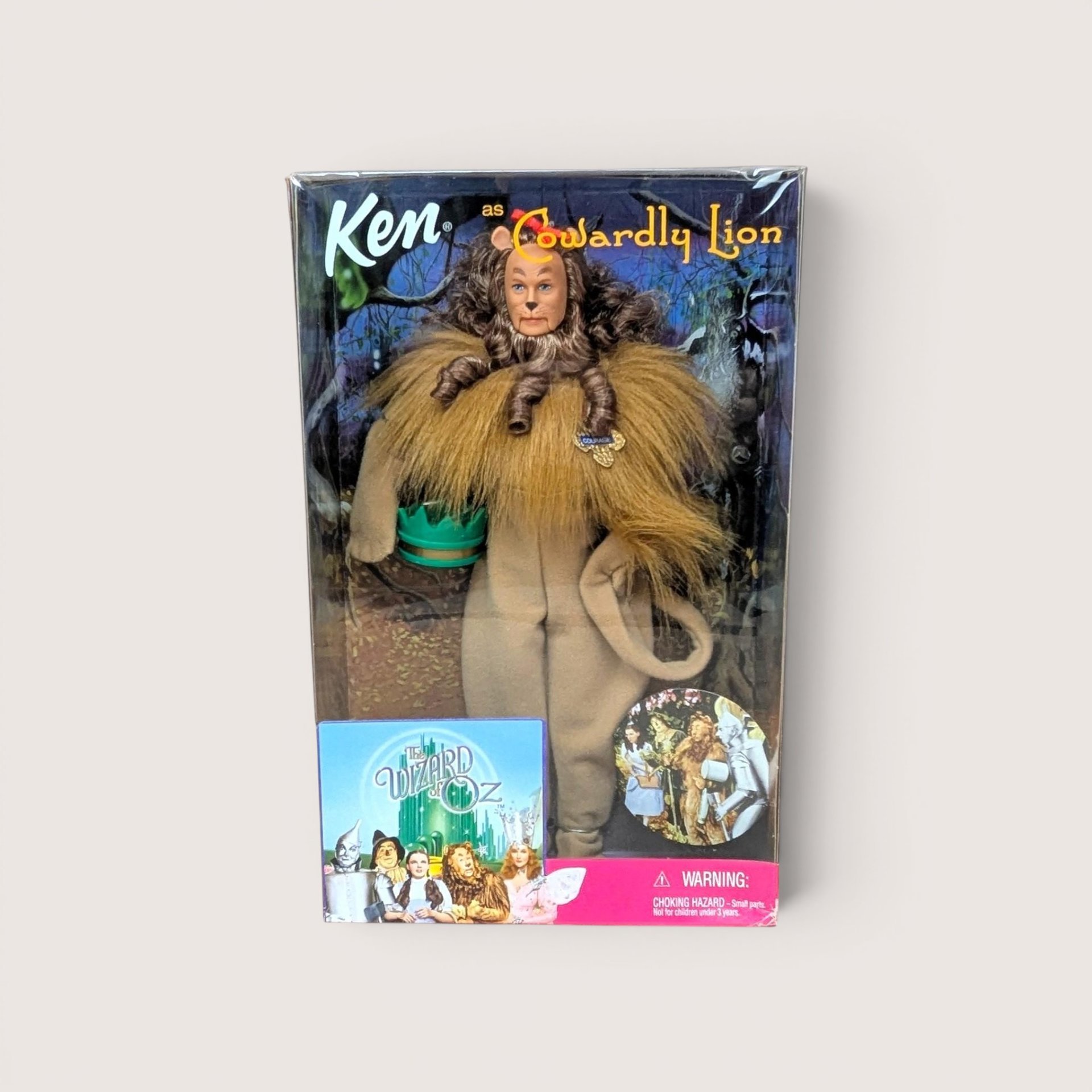 Ken as the Cowardly Lion Barbie doll in its original box packaging, centered on a neutral background.