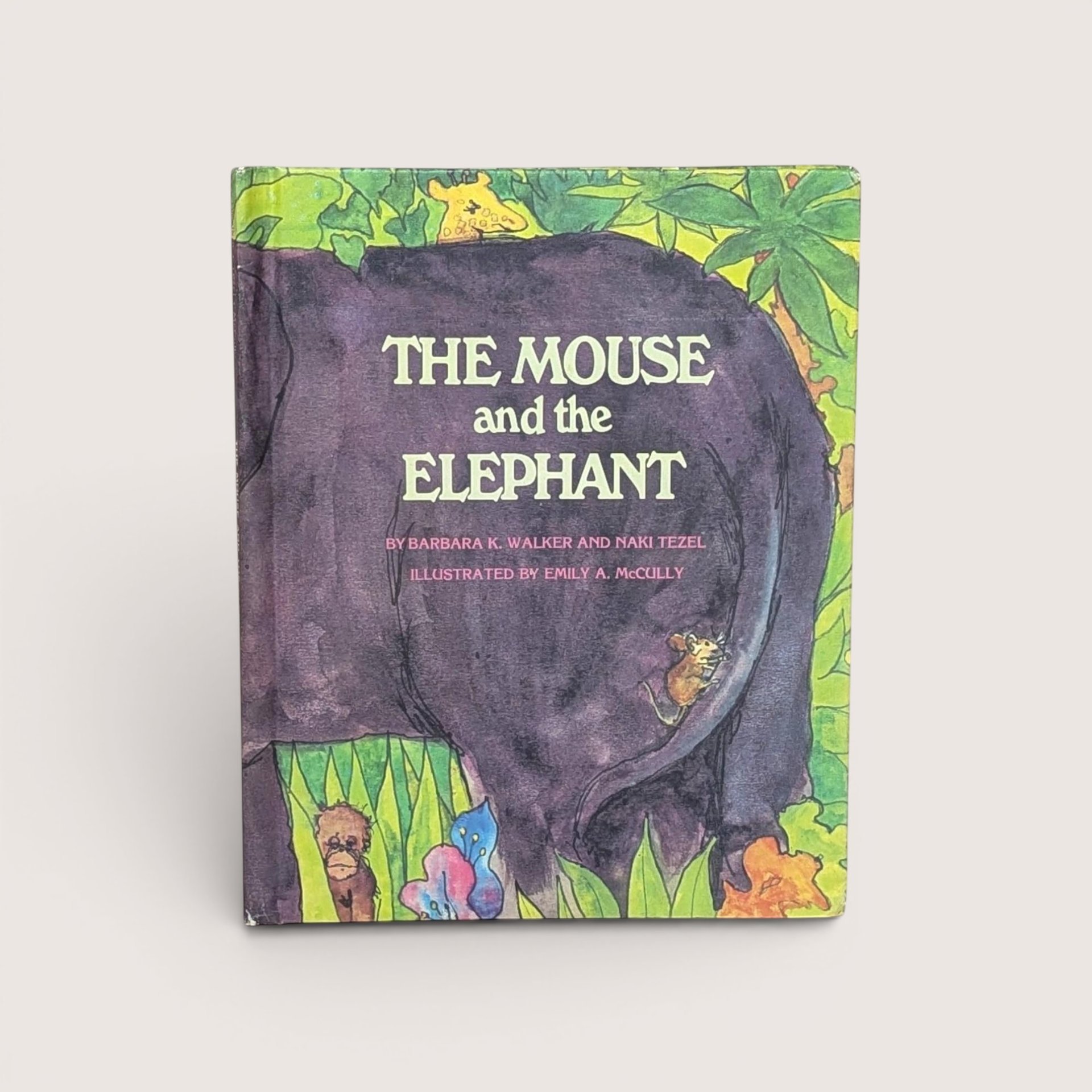 1969 vintage The Mouse and the Elephant hardcover book cover featuring a large purple elephant in a green jungle.