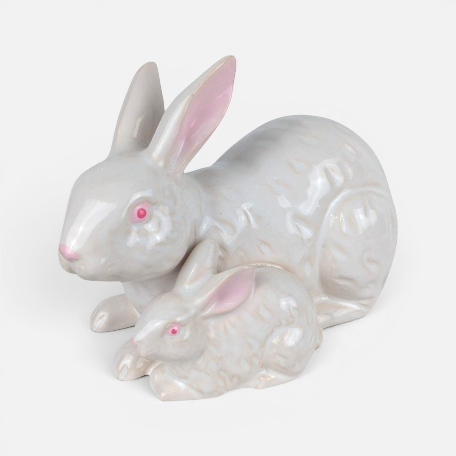 Vintage glossy white ceramic Rosenthal Netter bunny figurine with a smaller baby rabbit and pink painted accents.