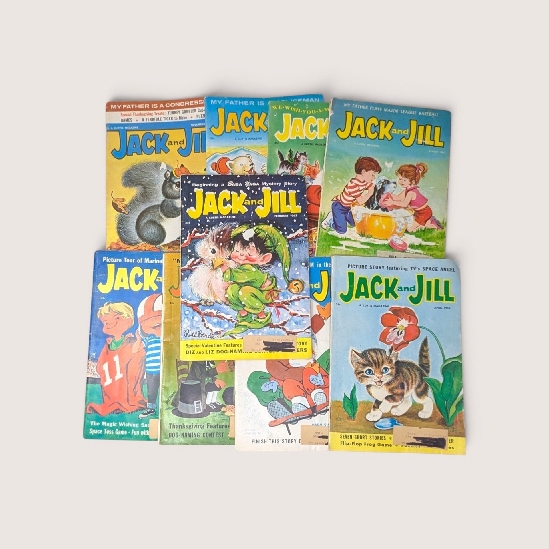 A collection of nine vintage Jack and Jill children magazines from the 1960s with colorful illustrated covers.