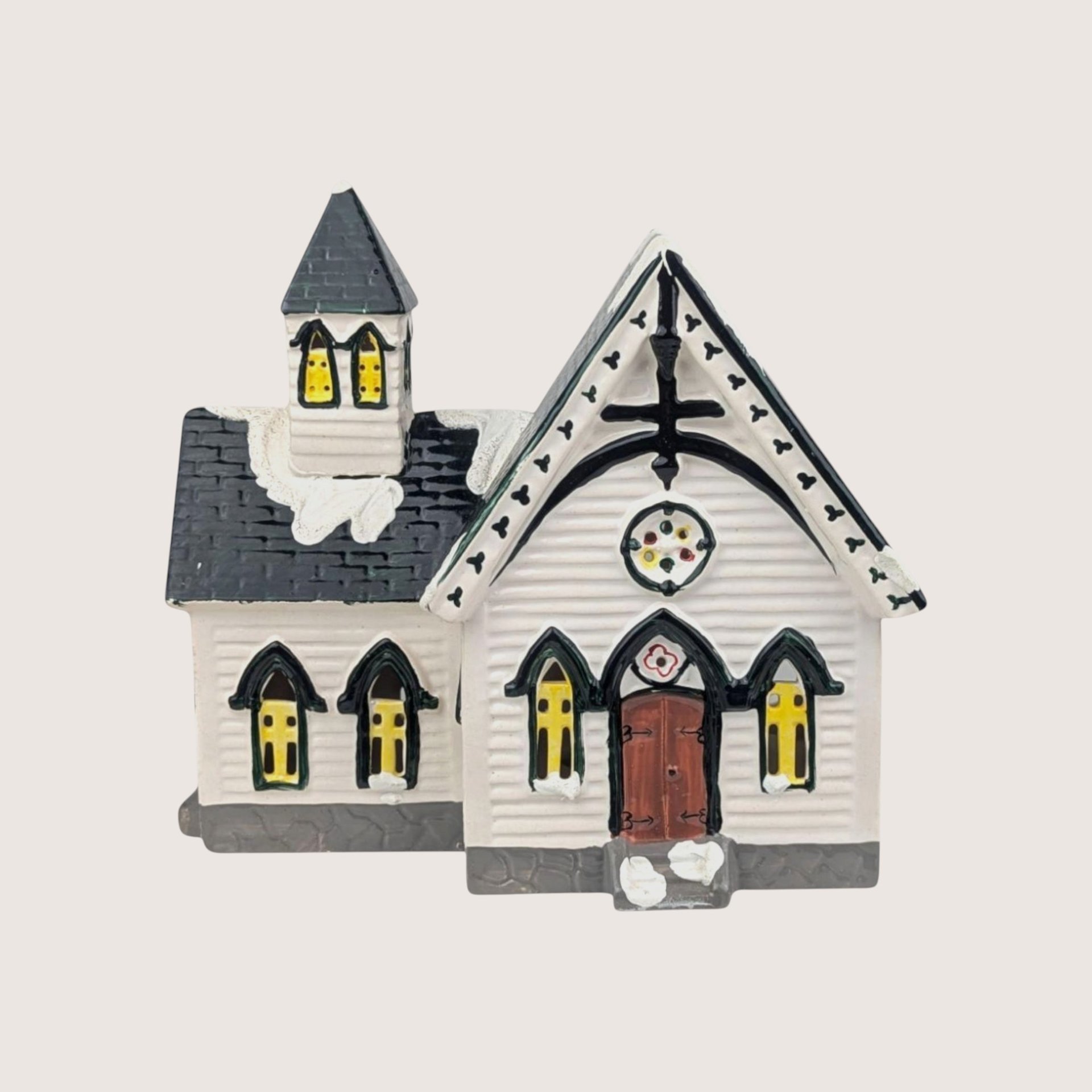 Department 56 Church of the Open Door ceramic building with white clapboard siding and a dark shingled roof spire.