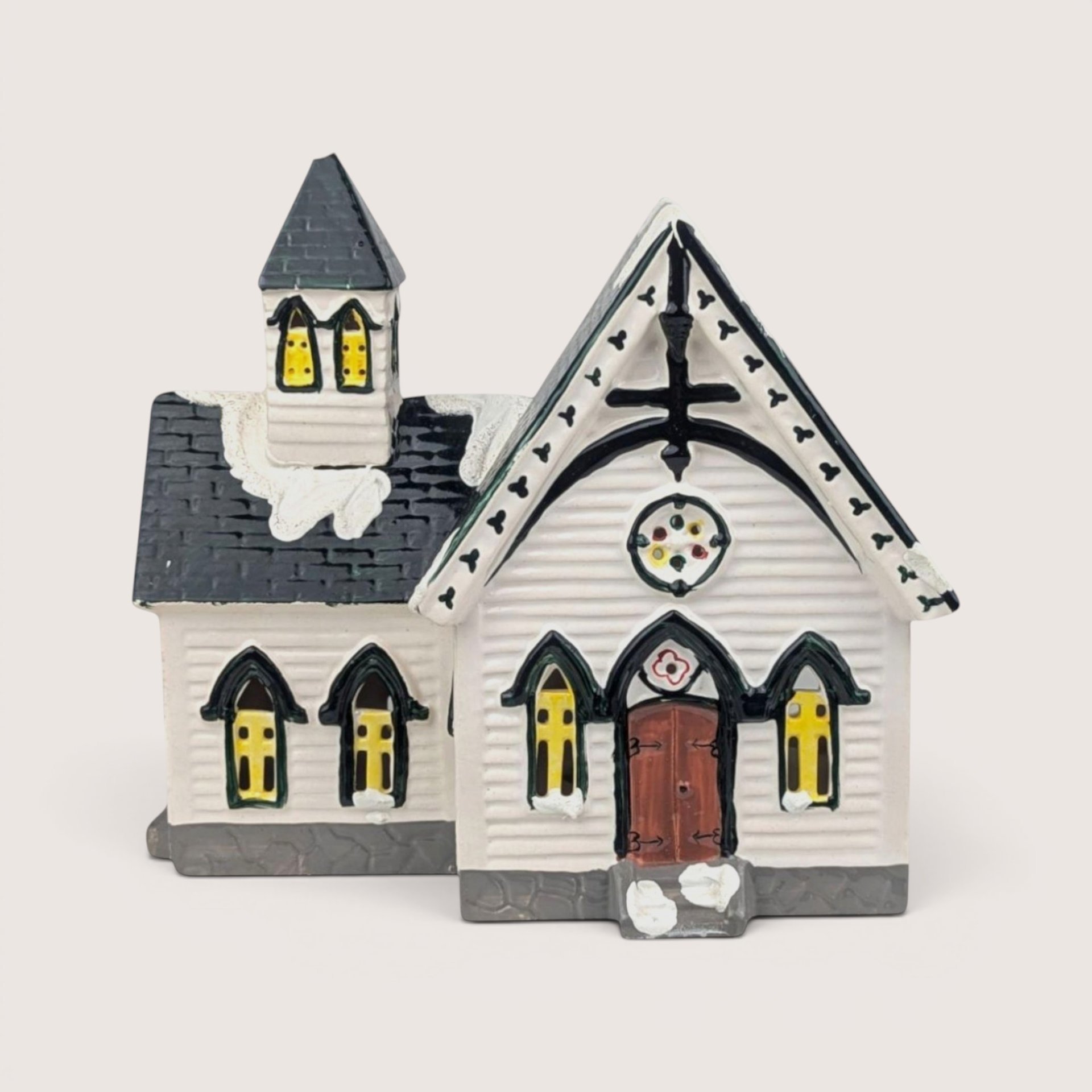 Department 56 Church of the Open Door ceramic building with white clapboard siding and a dark shingled roof spire.