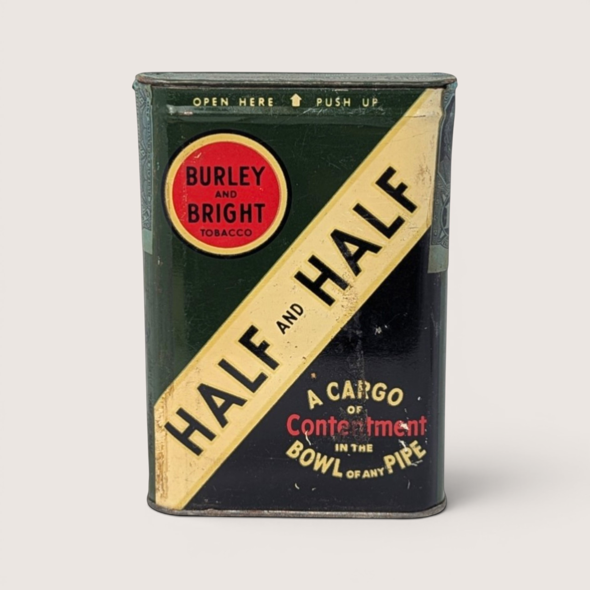 Vintage empty Half and Half pocket tobacco tin with a green and black split design and a yellow diagonal sash.