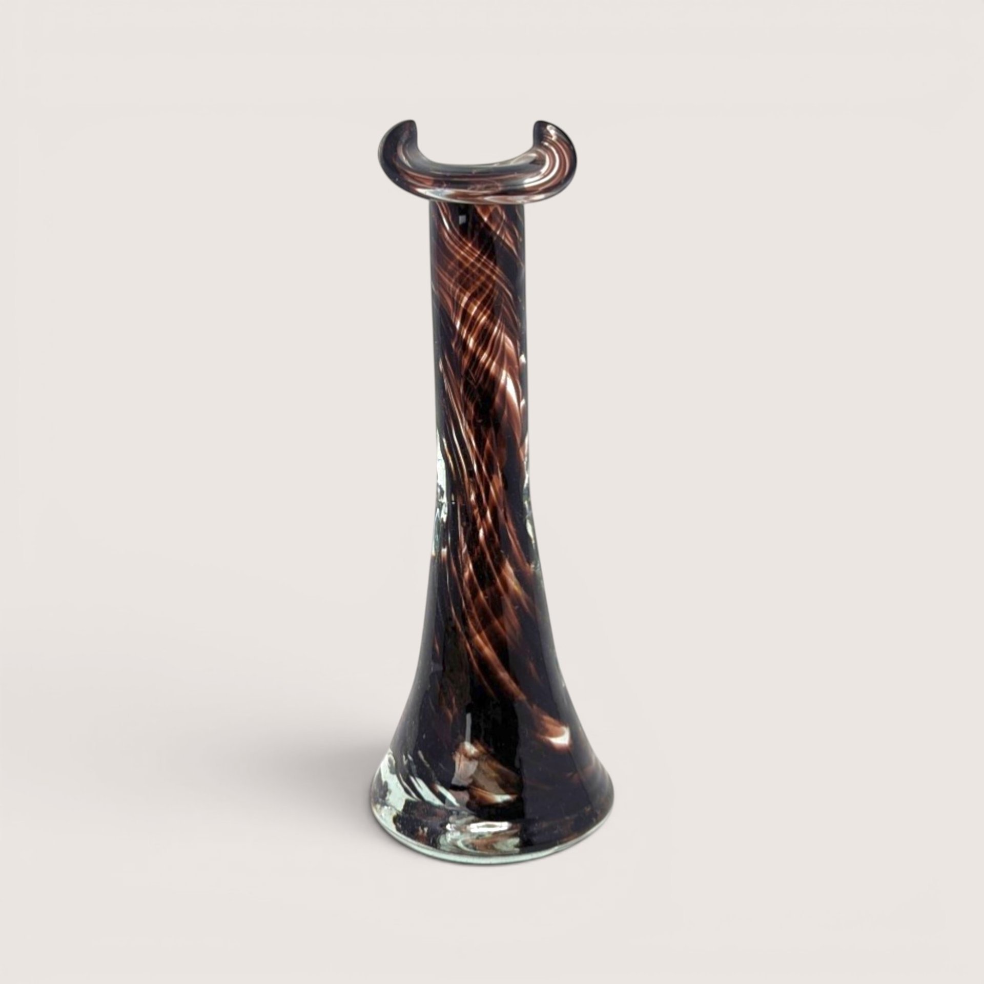 Vintage 1970s Murano style art glass bud vase featuring a deep brown ribbon swirl pattern and a pinched tricorn rim.