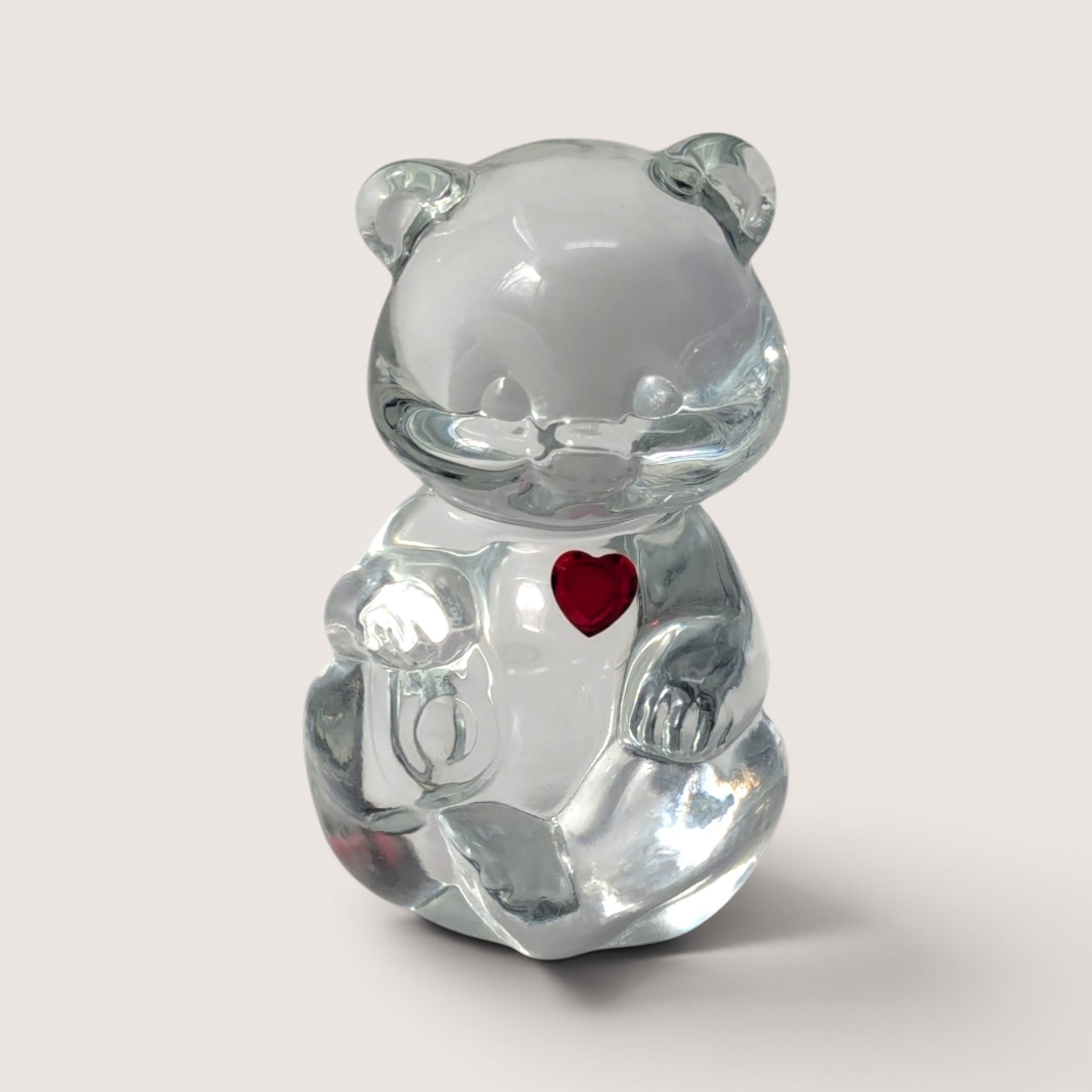 Vintage clear Fenton art glass birthstone teddy bear figurine with a red ruby heart rhinestone for July.
