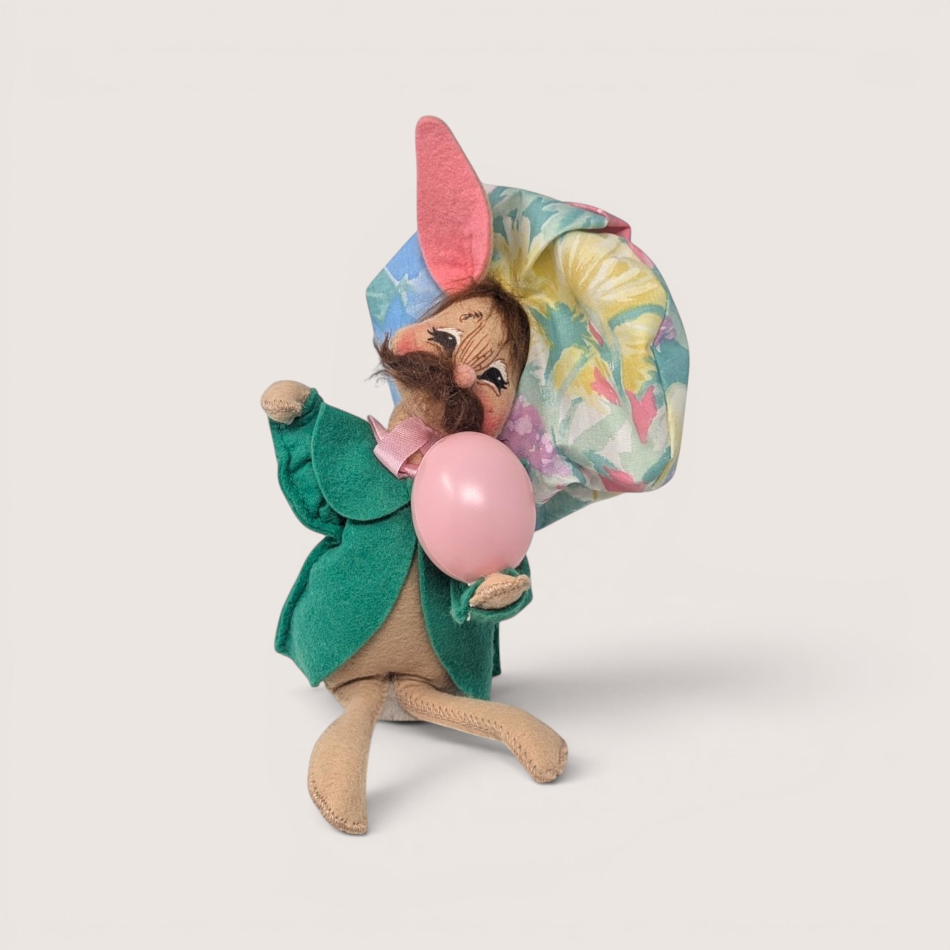 Vintage 1994 Annalee felt artist bunny doll wearing a green coat and a floral beret.