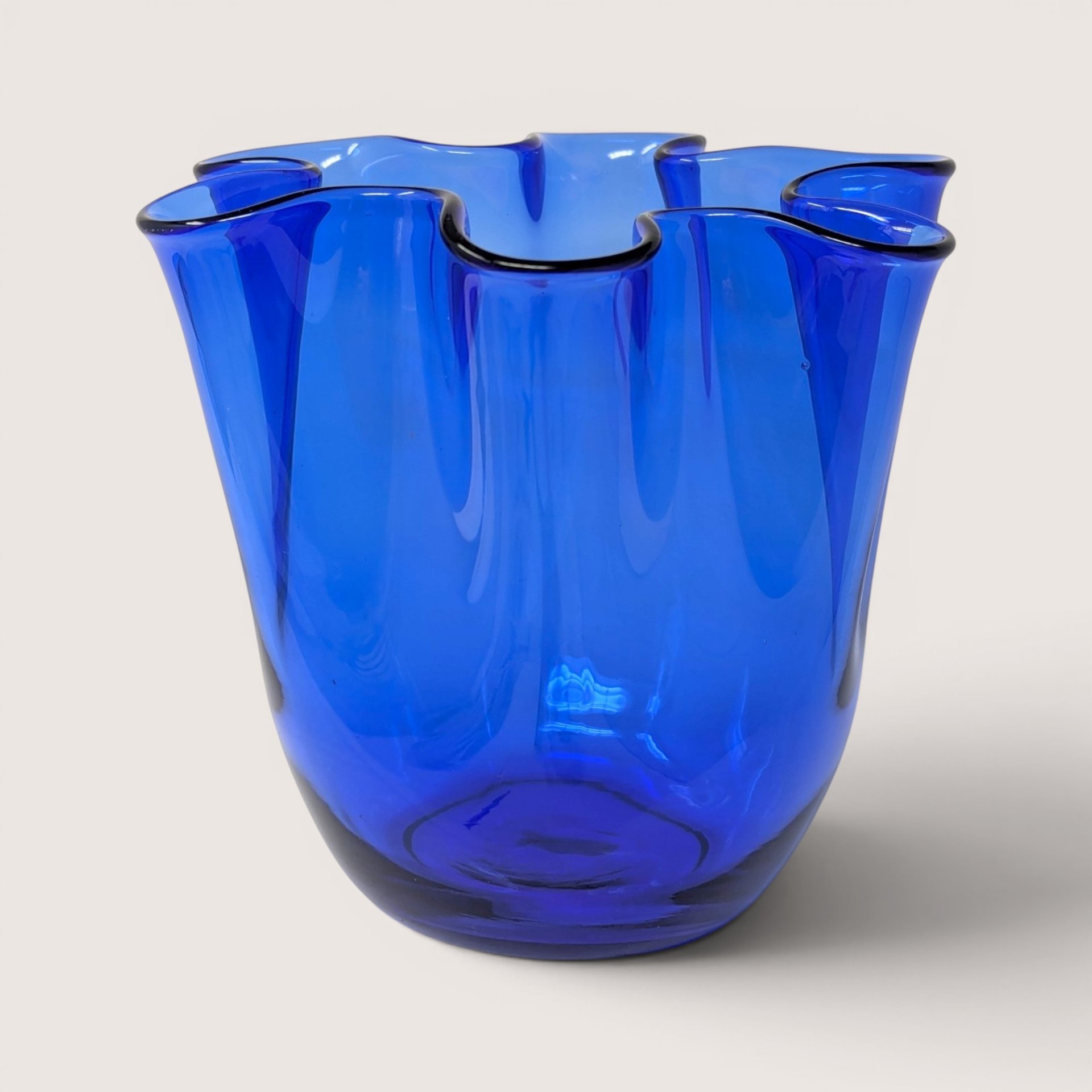 Vibrant cobalt blue mid-century blown glass fazzoletto vase with a ruffled handkerchief rim.