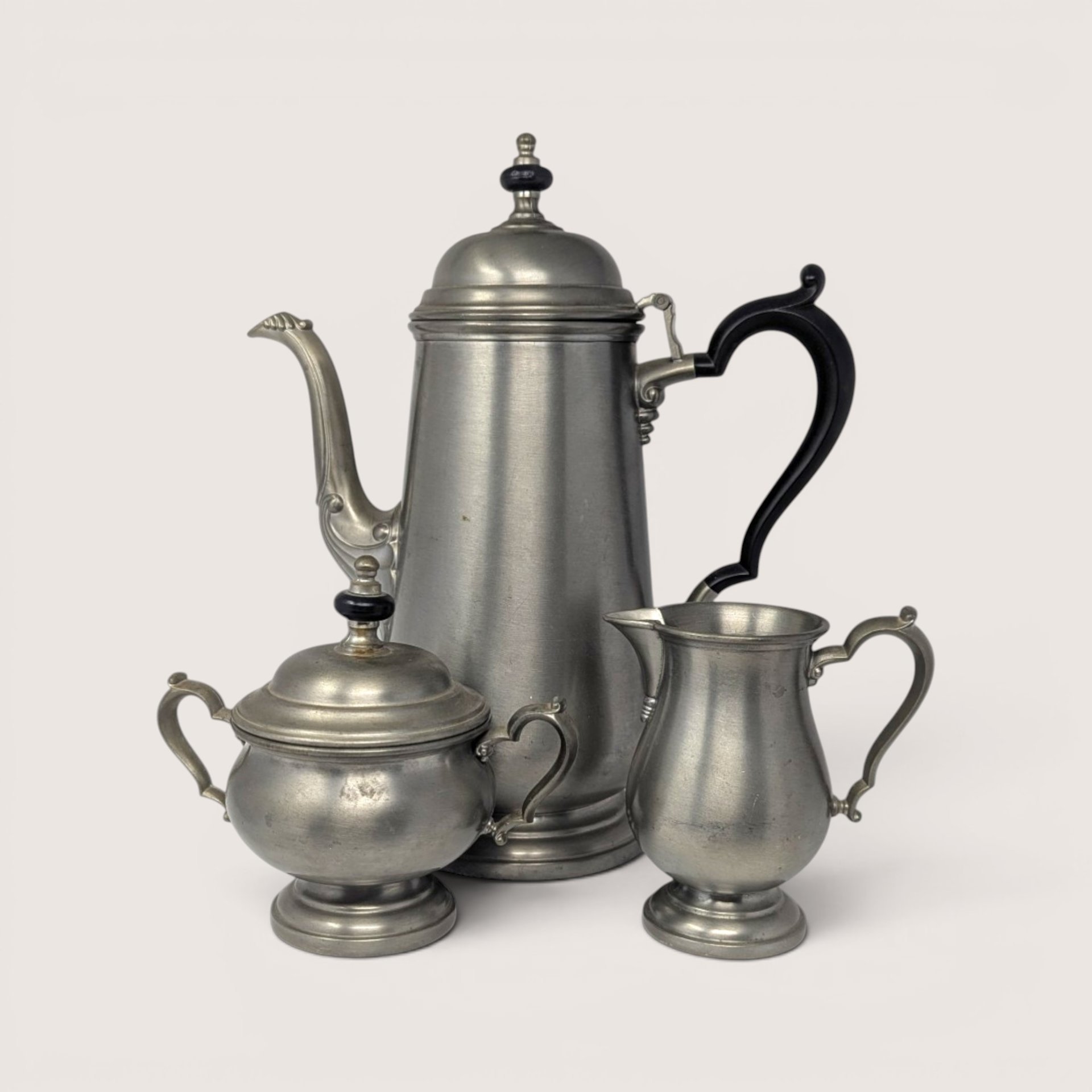 Vintage Three-Piece Oneida Heirloom Pewter Tea Set including teapot, sugar bowl, and creamer.