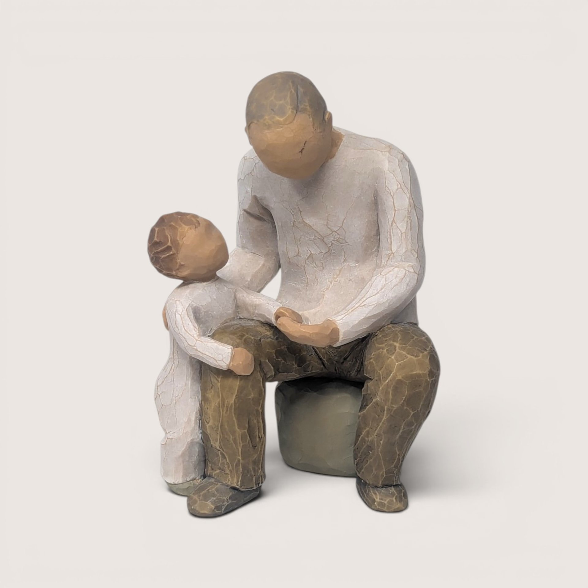 Tender Willow Tree grandfather figurine by Susan Lordi depicting an older man holding hands with a young child