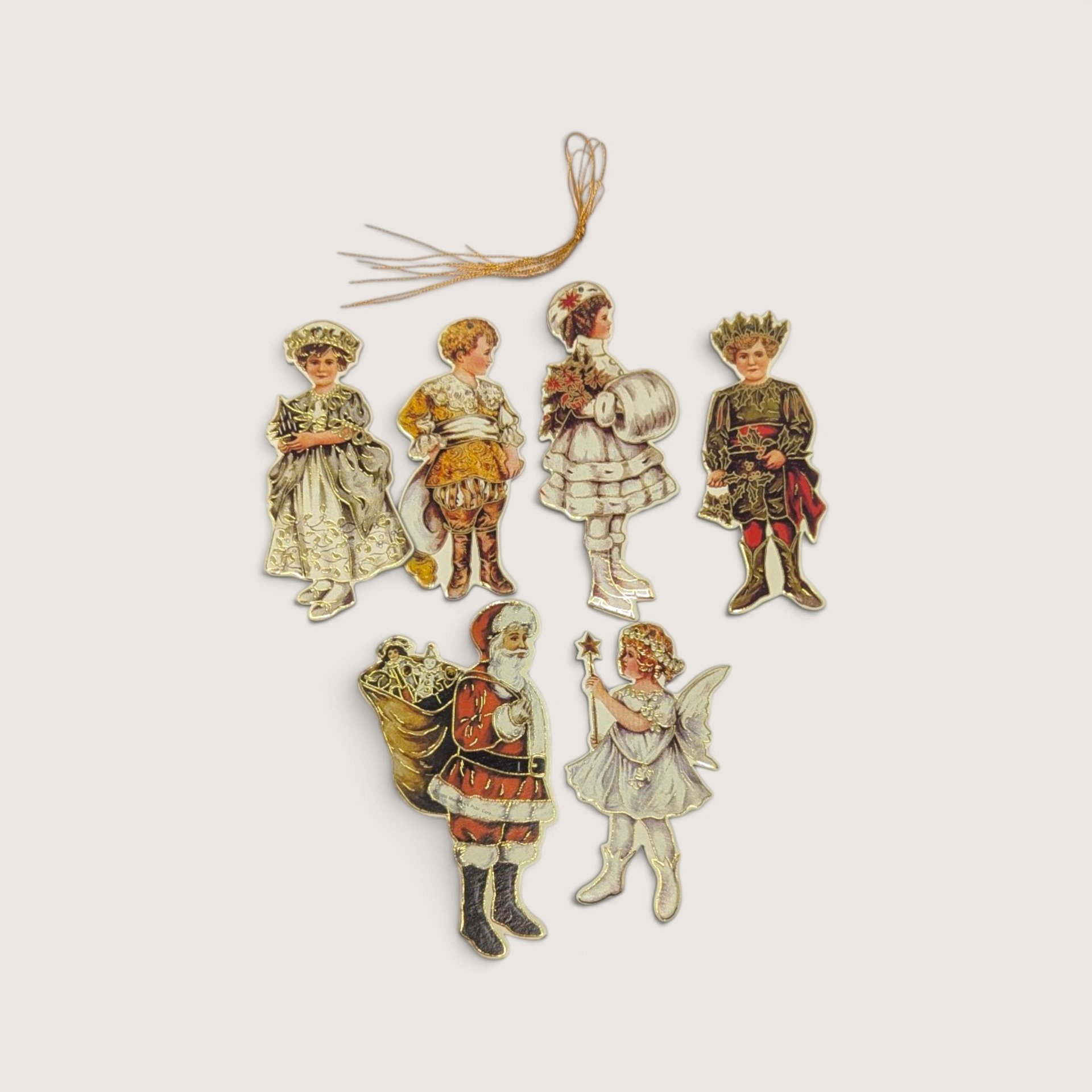 Set of 6 vintage 1986 Merrimack Betty Bonnet die-cut paper Christmas ornaments with gold strings.