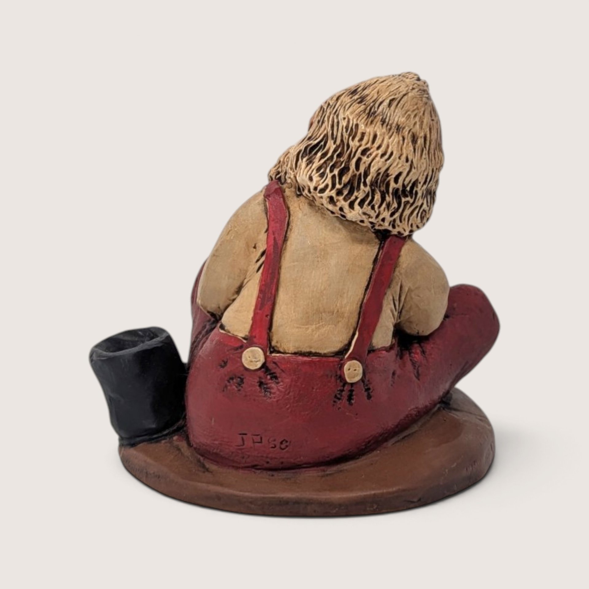Vintage Santa Putting On Boots Resin Christmas Figurine