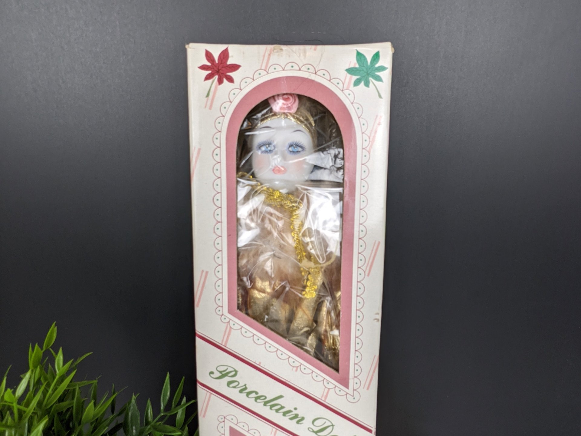 Vintage Porcelain Doll in Gold