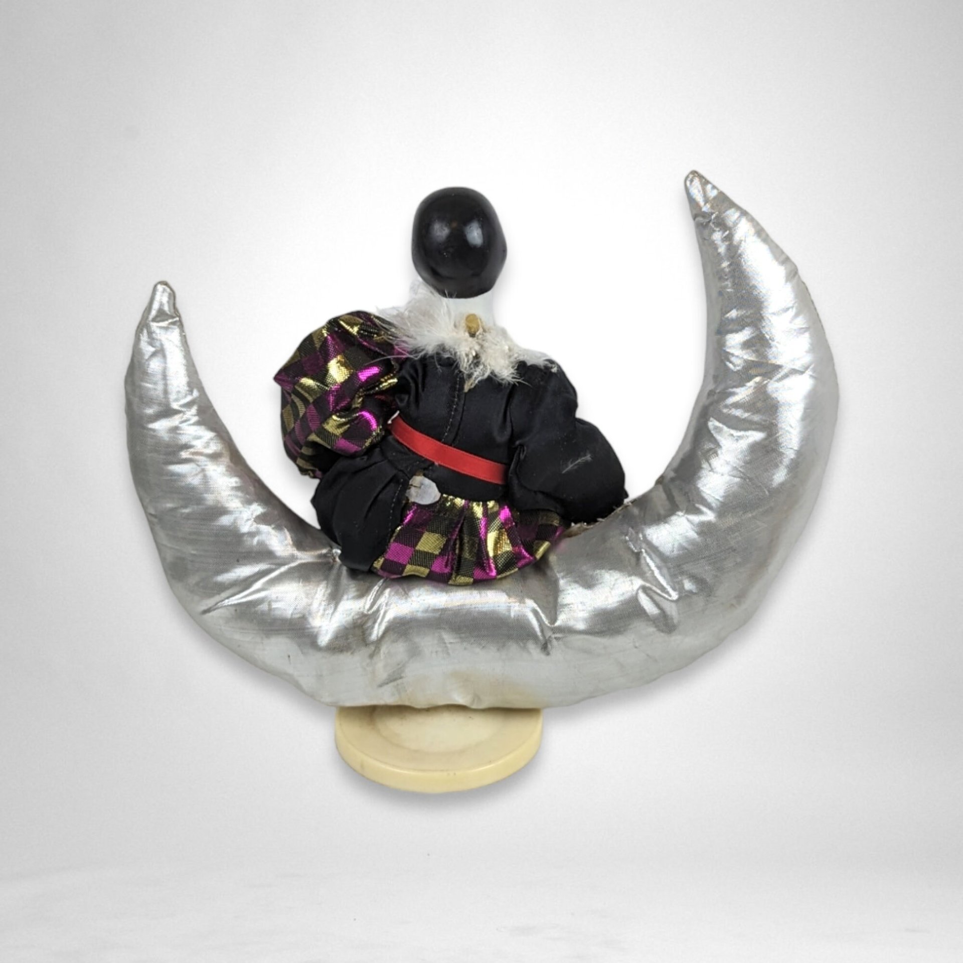 Harlequin Musical Doll on Moon