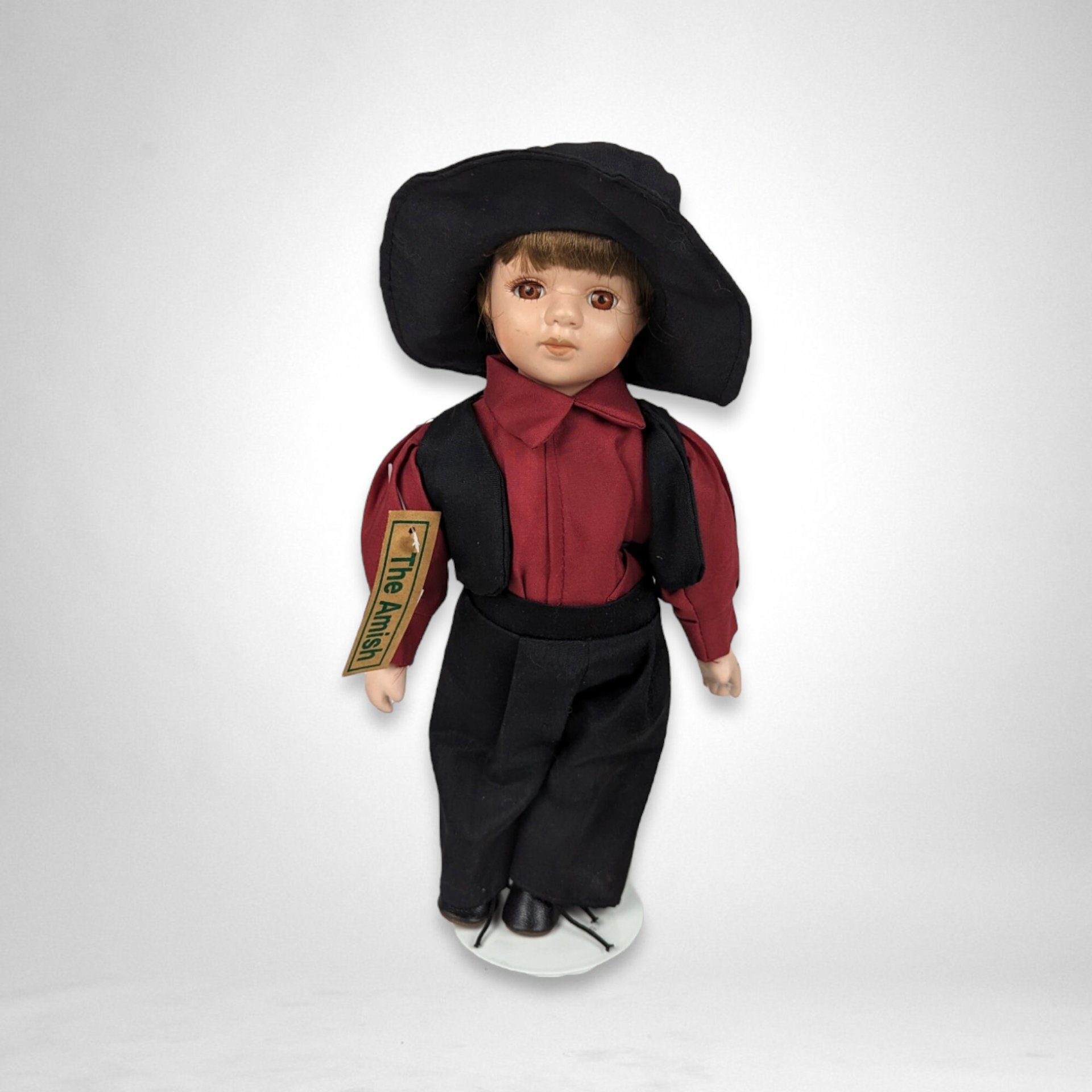 The Amish Porcelain Boy and Girl Dolls with Stands