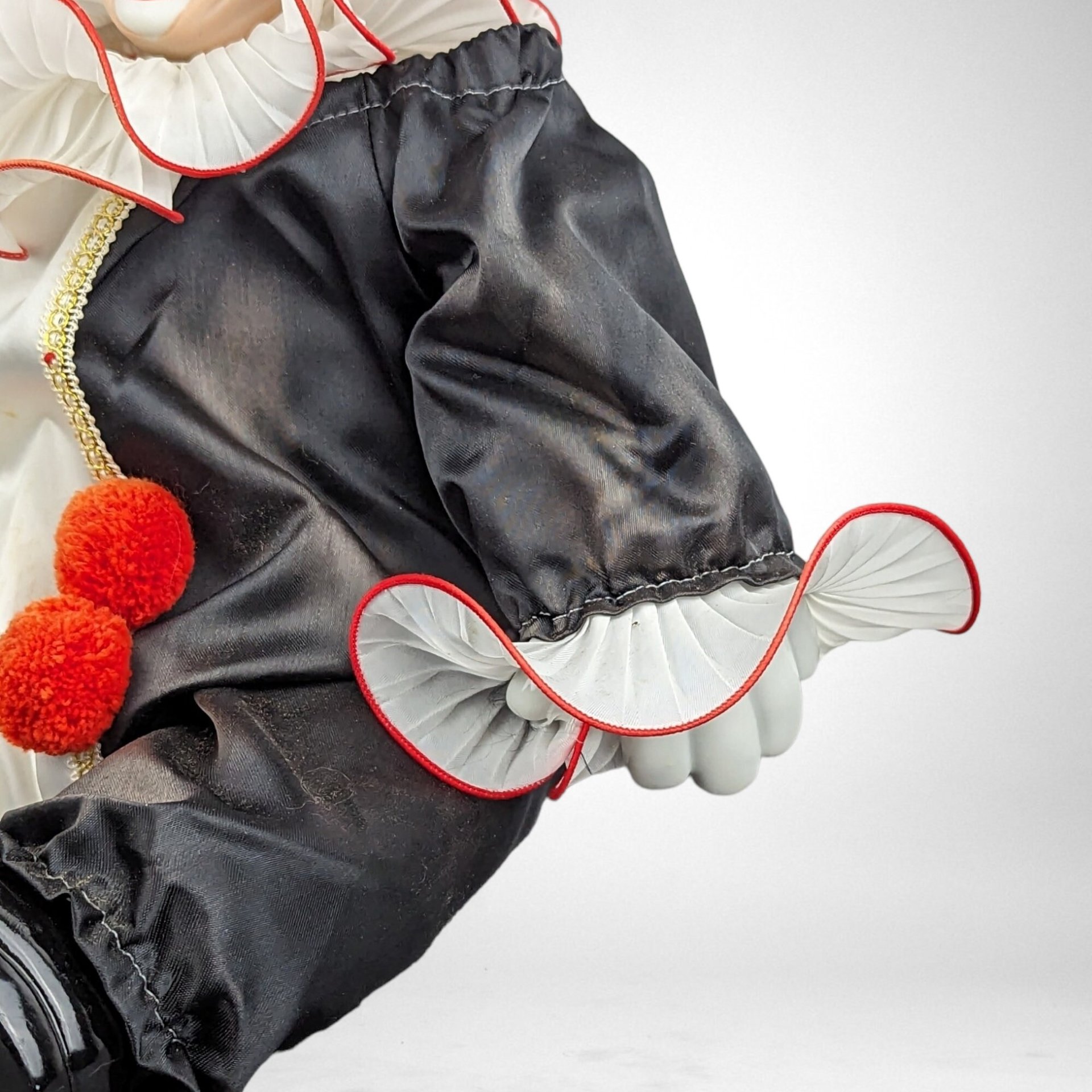 Porcelain Musical Sitting Clown Doll: Whimsical Melody and Delightful Decor