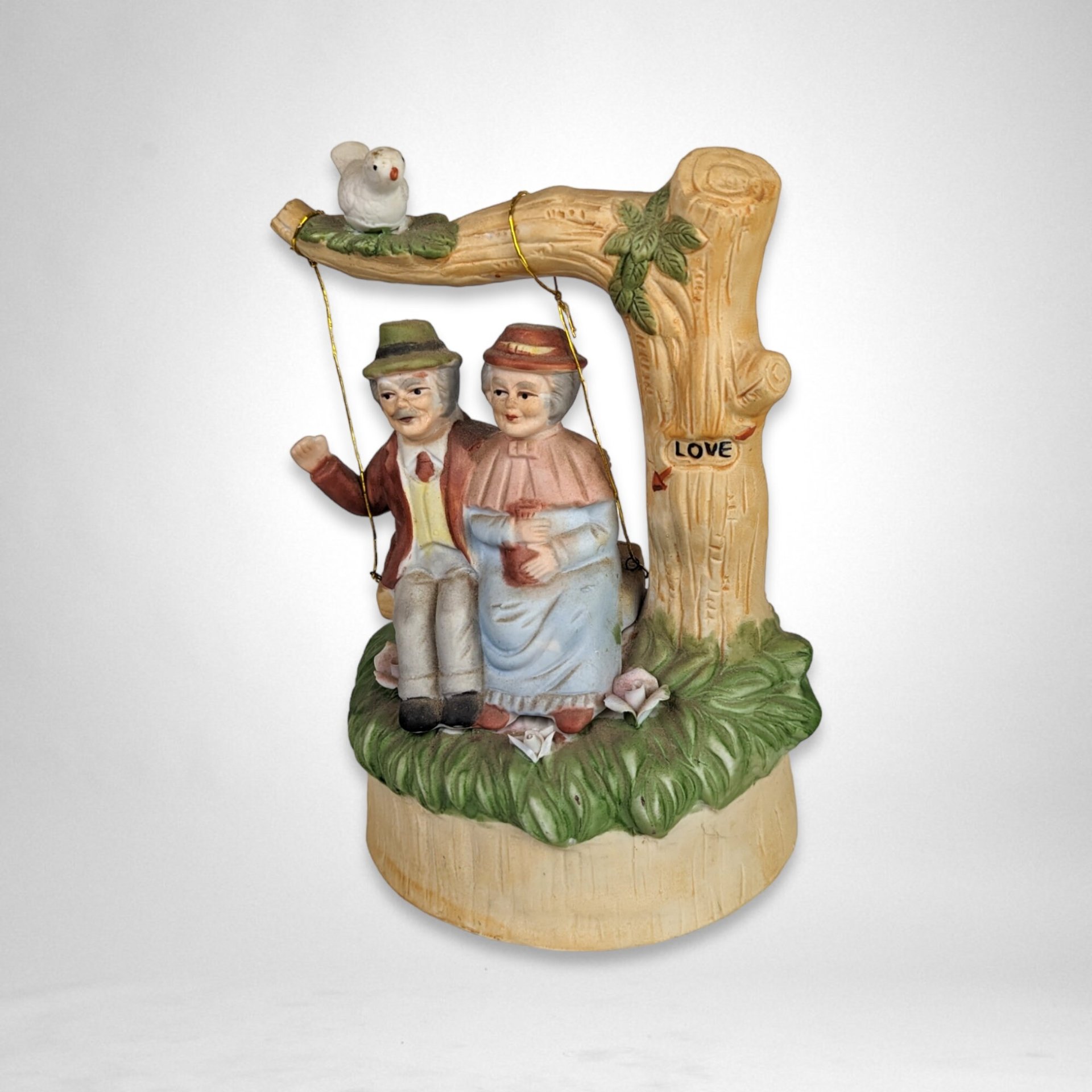 Artmark Ceramic Swinging Older Couple Music Box - Sentimental Melodies of Togetherness
