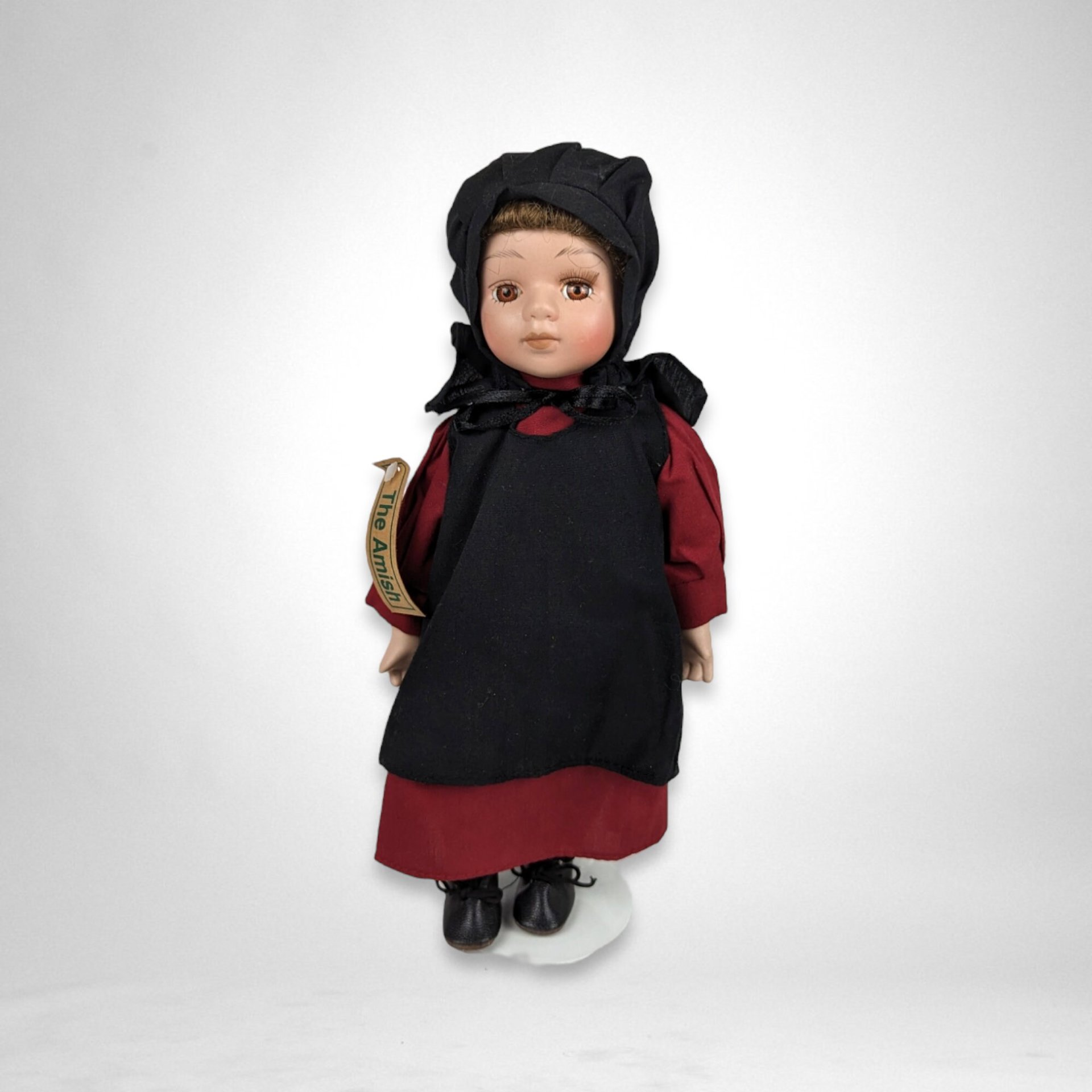 The Amish Porcelain Boy and Girl Dolls with Stands