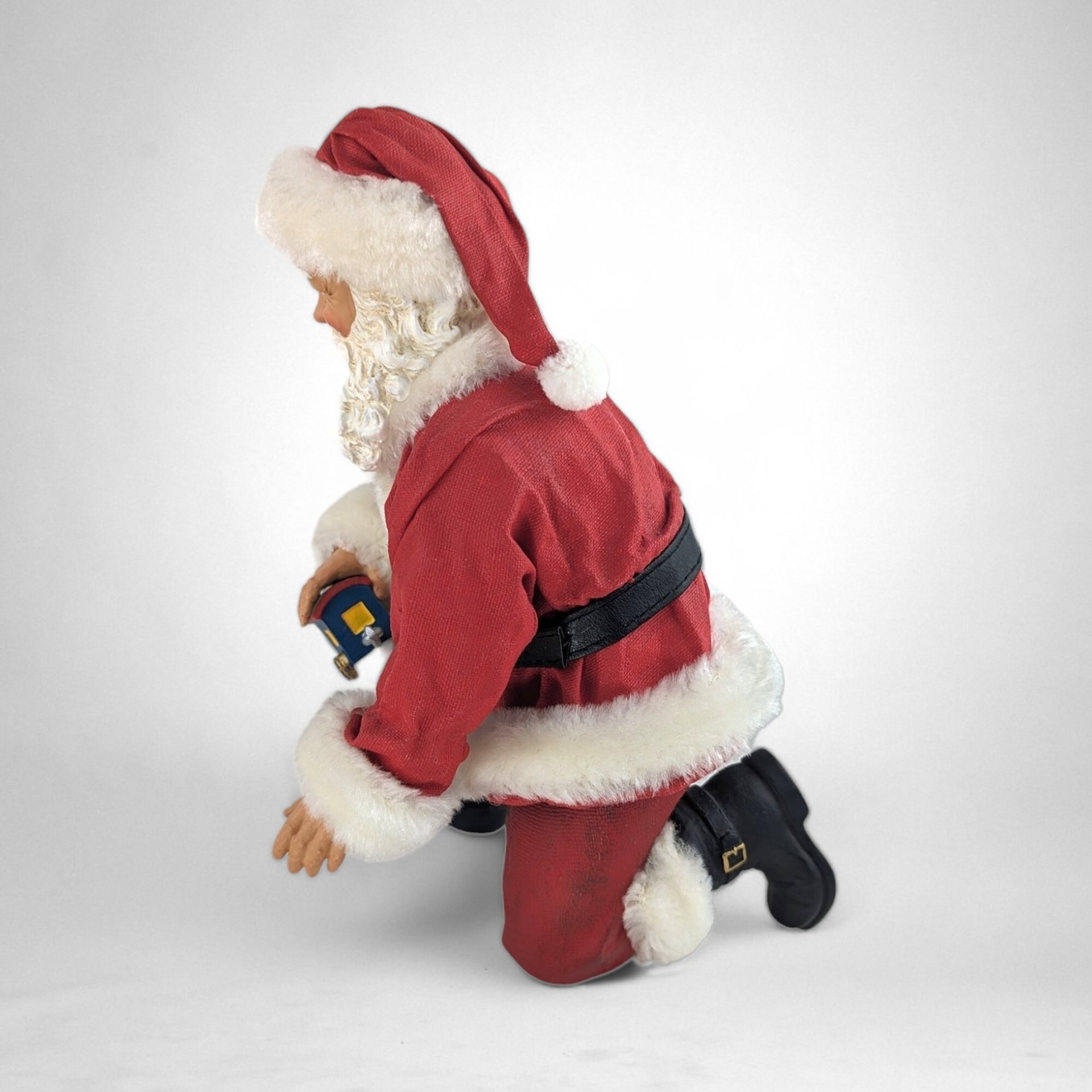 Vintage Fabriche Santa Kneeling Holding Toy Train Figure – Timeless Holiday Delight