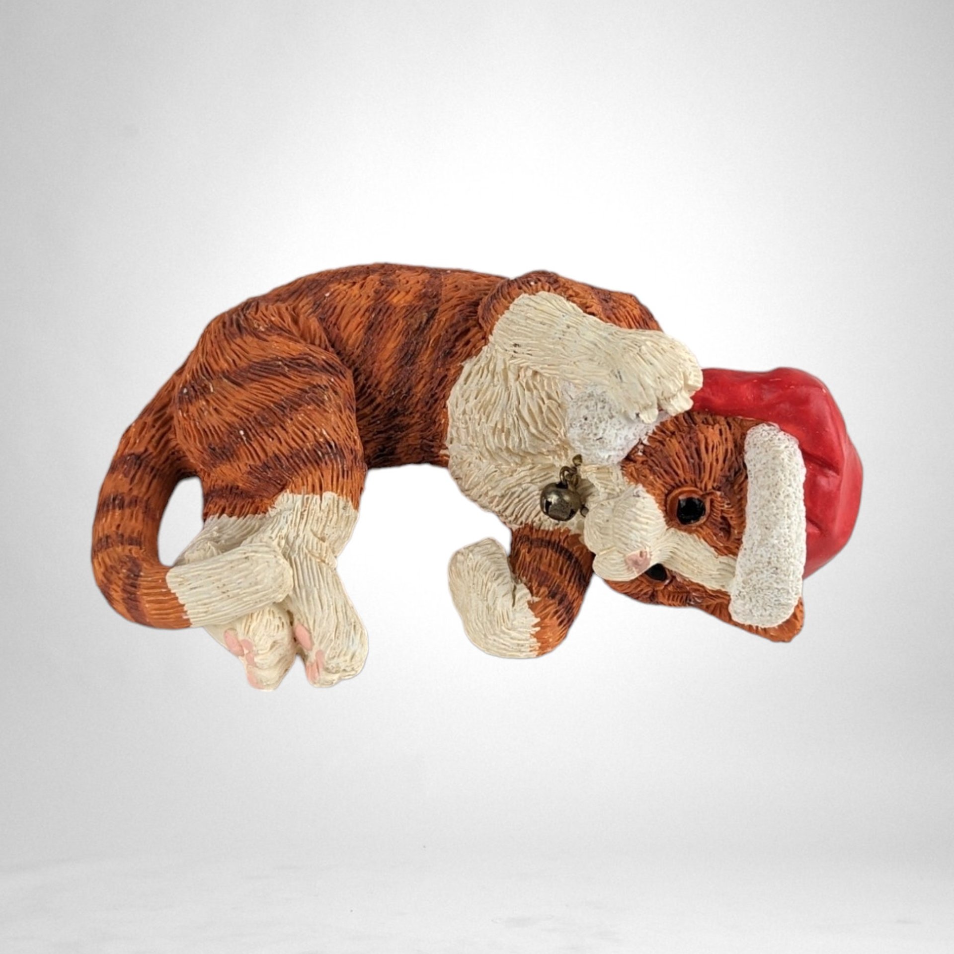 Whiskered Holiday Charm: 1995 Enesco Kathy Wise Resin Striped Cat with Santa Cap Figurine