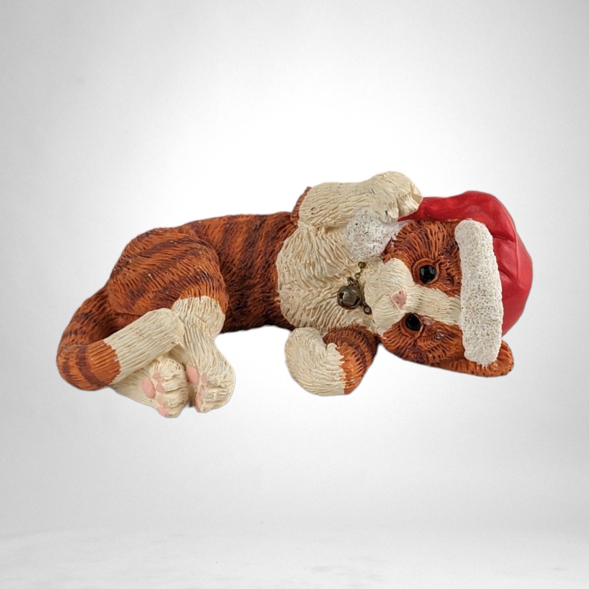 Whiskered Holiday Charm: 1995 Enesco Kathy Wise Resin Striped Cat with Santa Cap Figurine