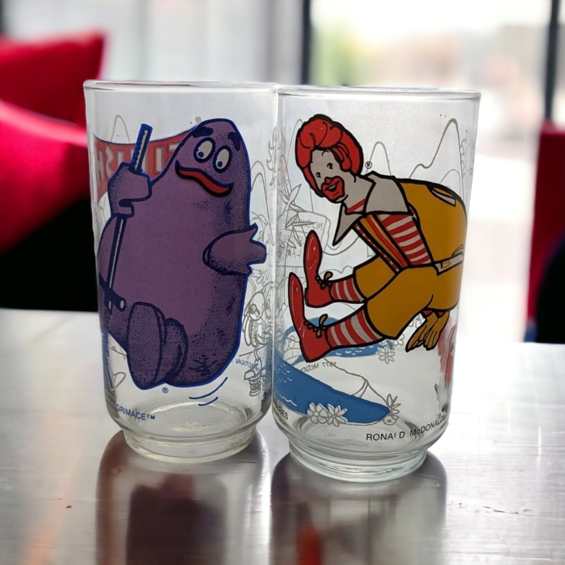 Pair of 1977 McDonald's Action Series Collectible Glasses - Retro Fast Food Memorabilia