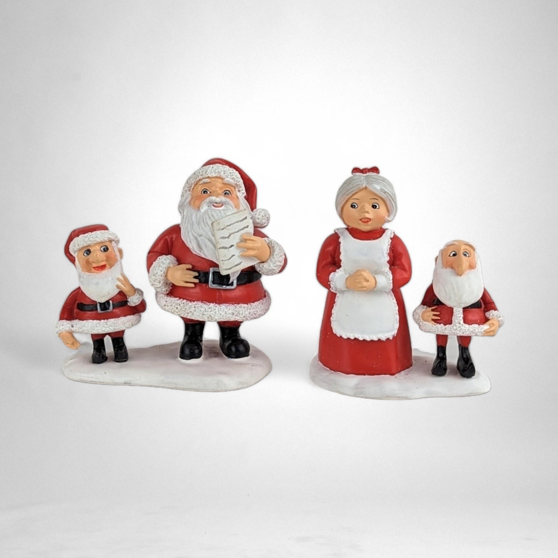 Dept. 56 Santa Claus is Coming to Town 2-Piece Figurine Set - Festive Mr. and Mrs. Claus with Elves