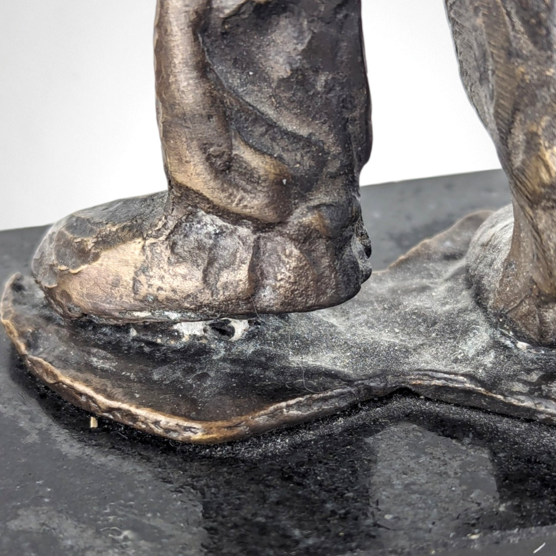 Swingin' Statue: Bronze Horn Player Blows Away in Vintage Charm