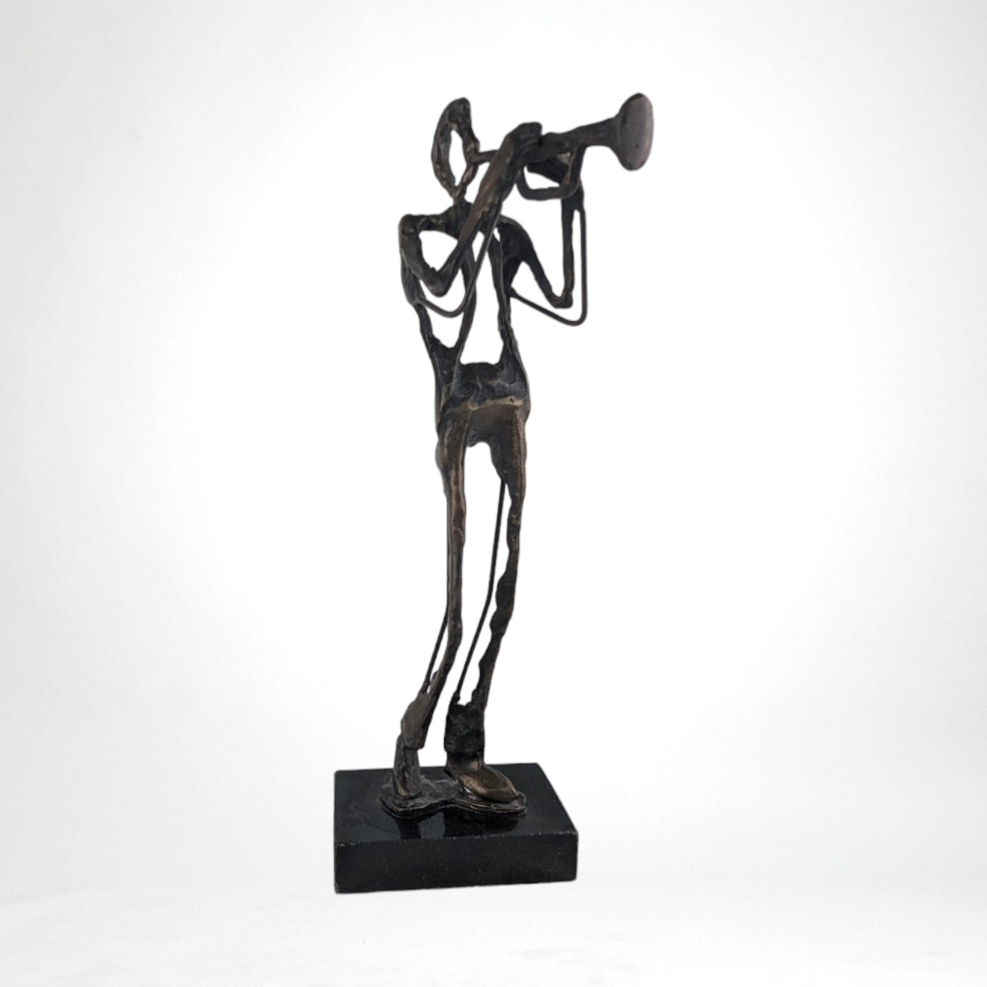 Swingin' Statue: Bronze Horn Player Blows Away in Vintage Charm