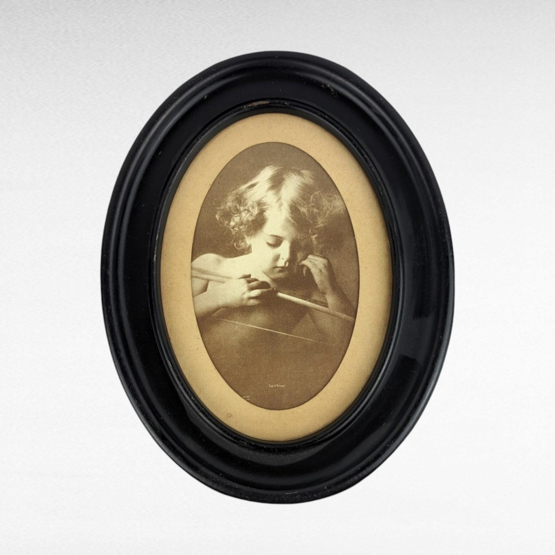 Vintage Cupid Asleep Framed Print by M.B. Parkinson - Romantic Wall Decor - Cherub Art - Oval Frame