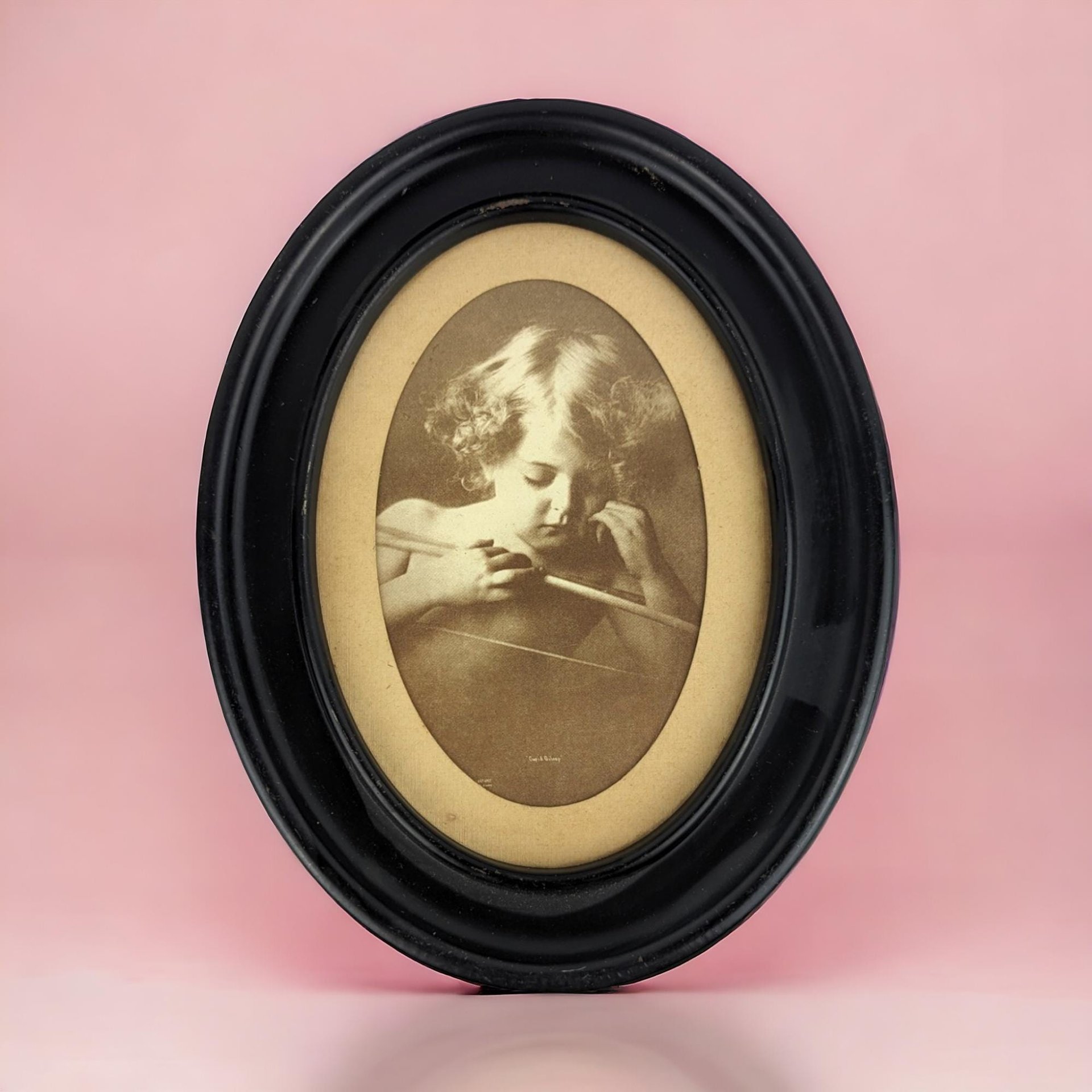 Vintage Cupid Asleep Framed Print by M.B. Parkinson - Romantic Wall Decor - Cherub Art - Oval Frame