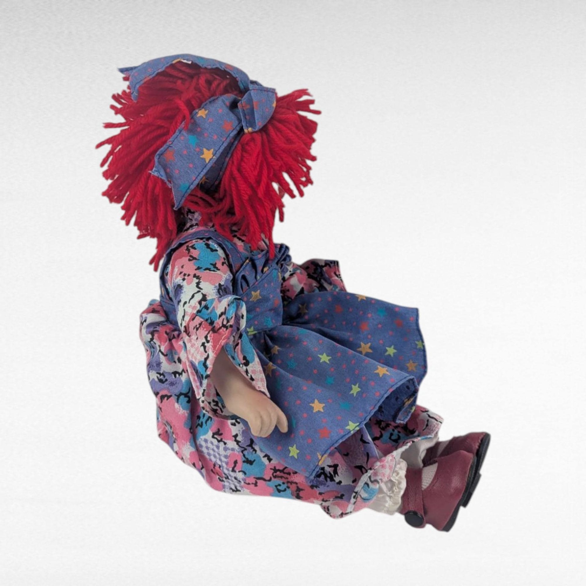 Vintage Porcelain Clown Doll, 9" Sitting Jester with Red Yarn Hair, Collectible Shelf Sitter Doll in Floral Star Dress