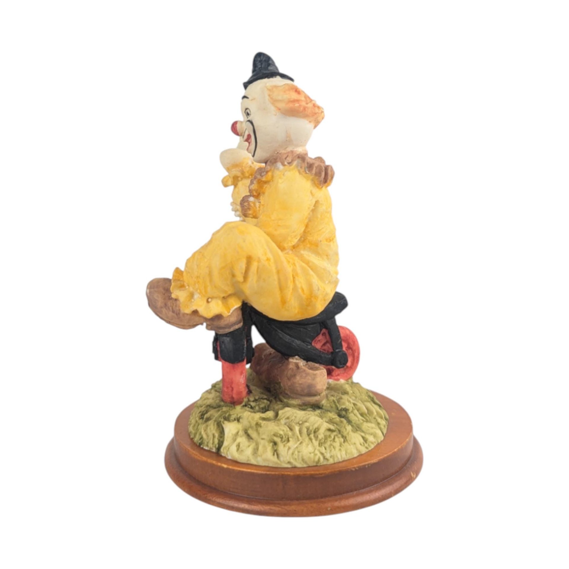 Vintage Waving Clown Figurine: Bicycle Rider