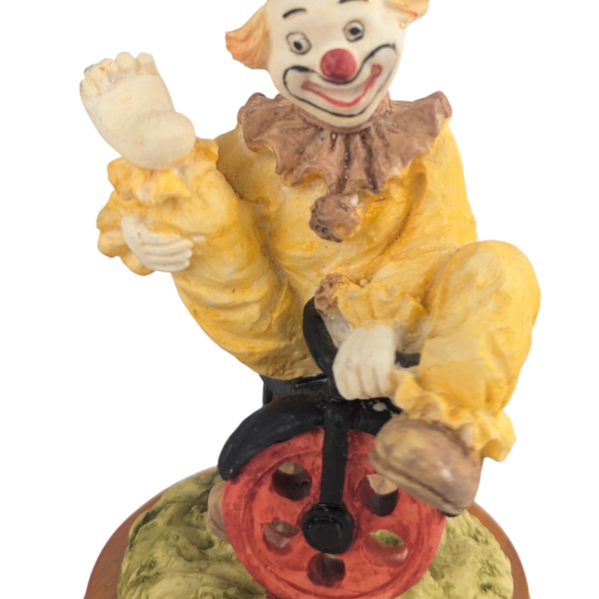 Vintage Waving Clown Figurine: Bicycle Rider