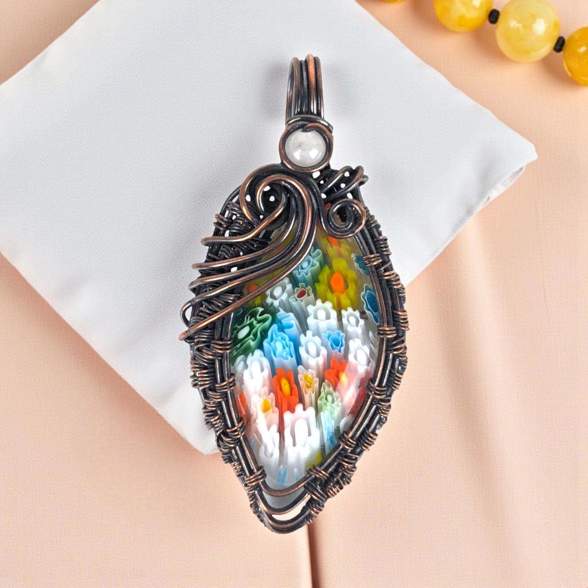 Handmade Millefiori Pendant: Copper Wire Wrapped Glass Necklace with Rose Quartz Accent