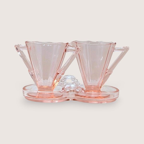 Vintage Cambridge pink glass sugar and creamer set on a matching double-well tray. Features 10-sided decagon panels and sharp geometric handles. 3.5 inches tall.
