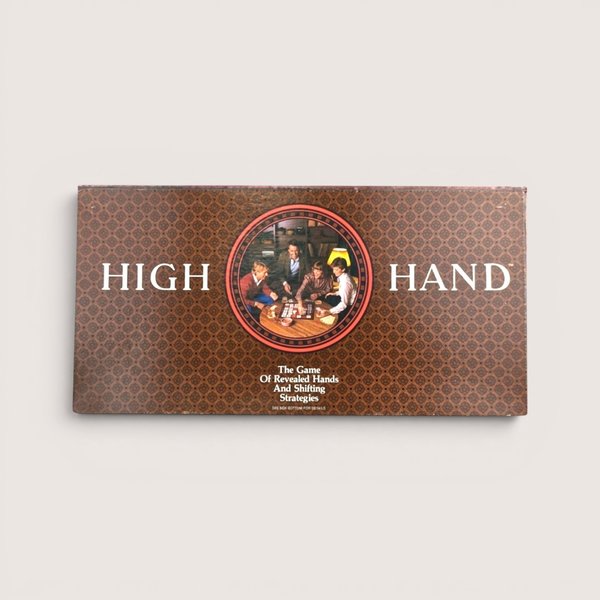 Vintage 1984 High Hand board game box with a brown geometric pattern and a central photo of a family playing a card game.  
