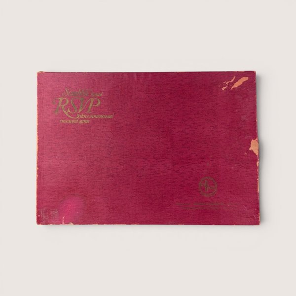 Vintage 1966 deep red textured cardboard box lid for the three dimensional crossword game Scrabble RSVP