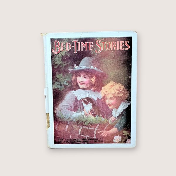 Antique Bed-Time Stories book cover featuring two children with a kitten, centered on a neutral background.