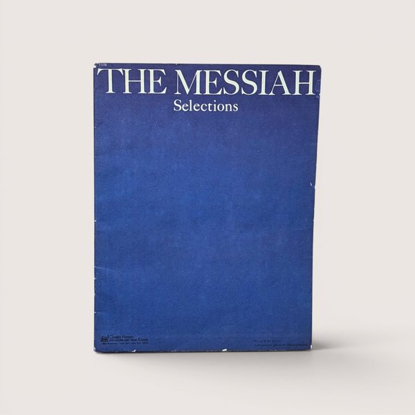 1951 vintage Selections from The Messiah piano music book cover in solid royal blue with white text.