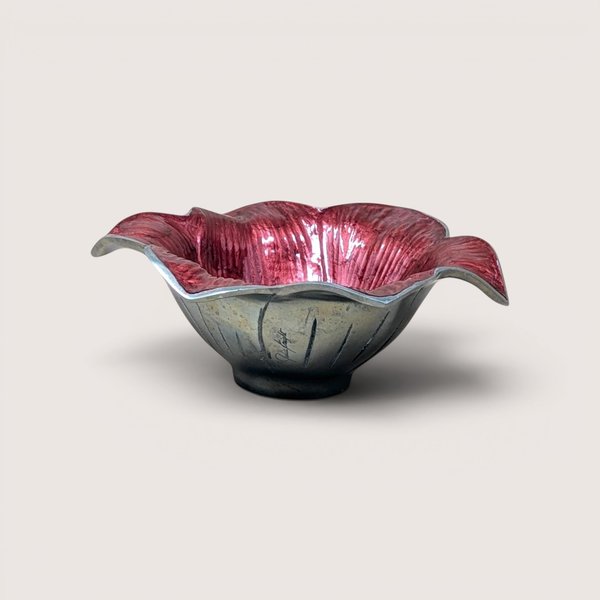 A sand-cast aluminum lily flower bowl with a glossy, jewel-toned raspberry pink enamel interior on a plain background.