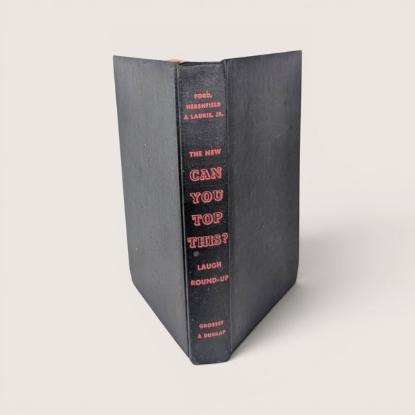 1947 hardcover book spine for The New Can You Top This? Laugh Round-Up in black cloth with orange text.