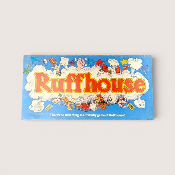 1980 Parker Brothers Ruffhouse vintage board game box featuring bright blue backgrounds and comic book illustrations.