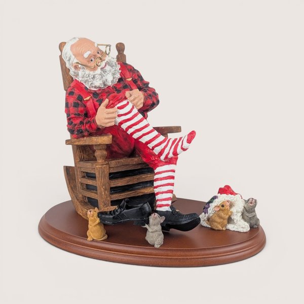 Vintage Department 56 Bachman's Santa's Dress Rehearsal figurine set featuring Santa in a rocking chair with mice on a wood display stand.
