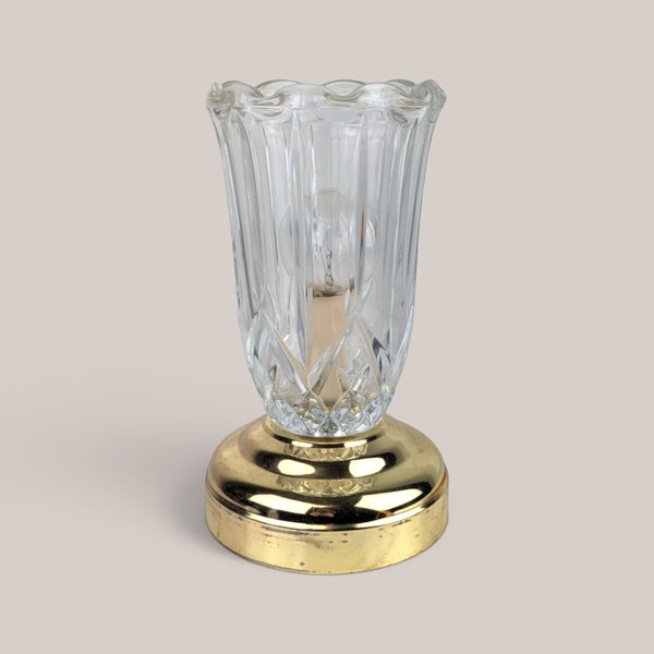 Vintage small clear glass and brass accent lamp with a fluted shade design and a visible interior bulb.