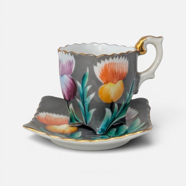Trimont Occupied Japan porcelain demitasse cup and saucer with hand painted purple and orange thistles.