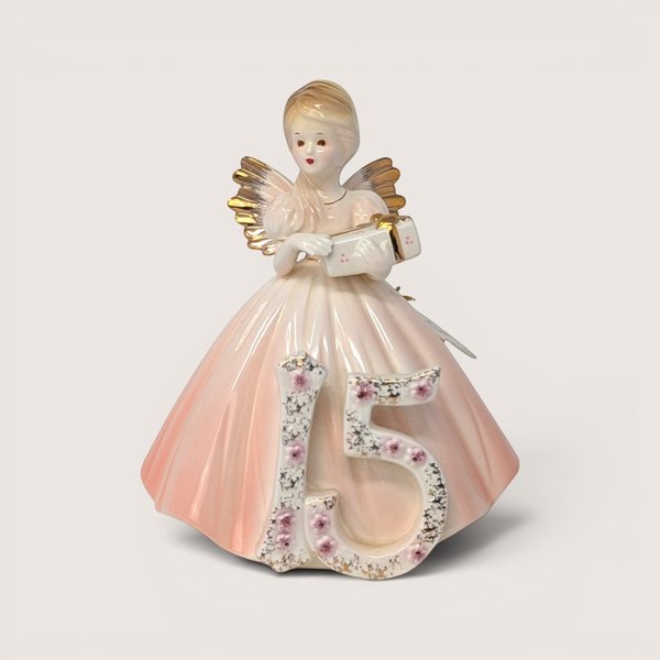 Vintage Josef Originals age 15 birthday girl porcelain figurine wearing a pink gown with gold angel wings.