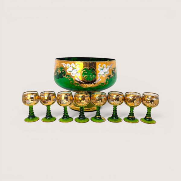 Vintage Bohemian green glass cordial set featuring a large gold rimmed pedestal bowl and eight matching glasses.