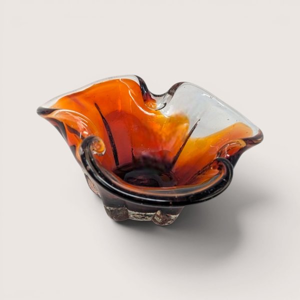 Vintage hand-blown art glass bowl featuring a warm amber to deep red gradient and a folded tri-corner shape.